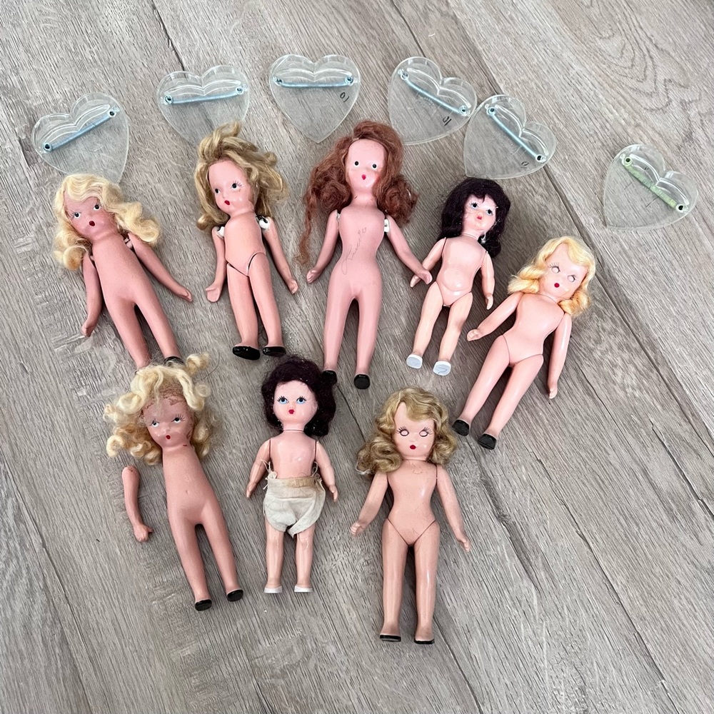 Vintage 8 PCs bisque Nancy Ann Storybook Dolls & 6 PCs Clear Heart Shape Stands
